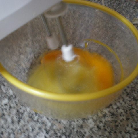 Beating eggs for avgolemono sauce image