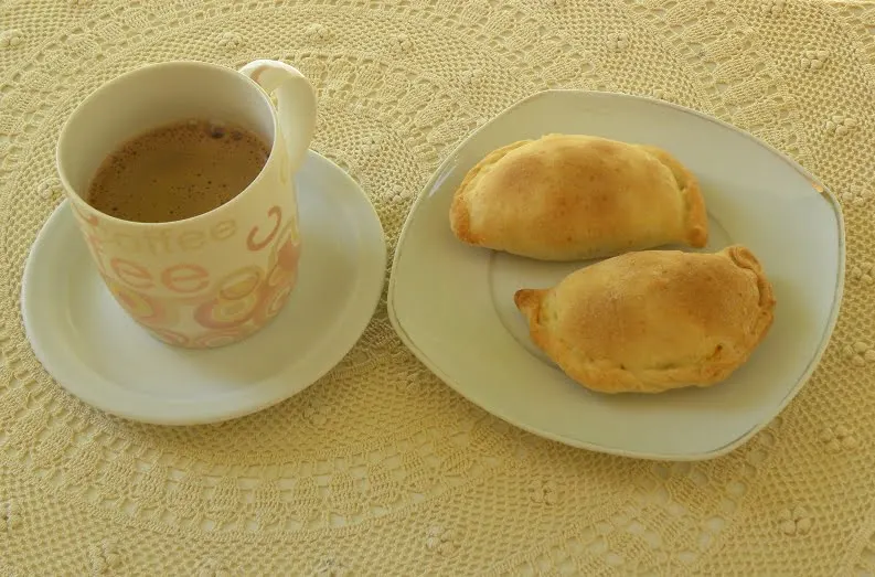 Kolokotes with a cup of coffee image