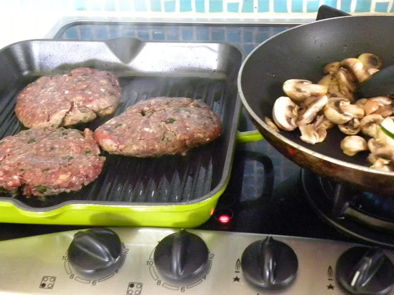 burgers in a cast iron pan image