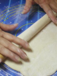 rolling dough by hand image