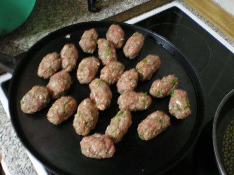 Shaping meatballs keftedes image