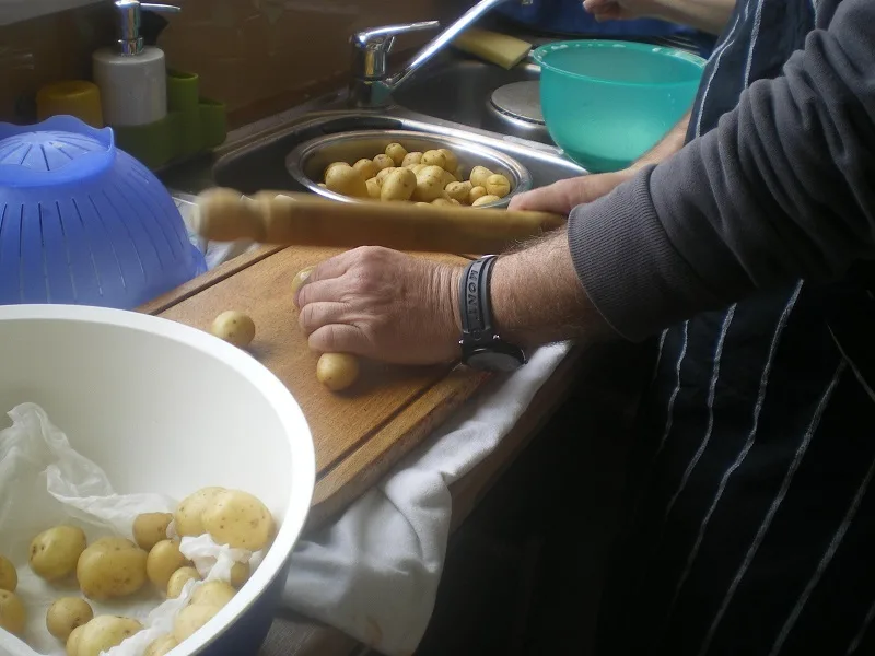Smashing the potatoes with a dowel image