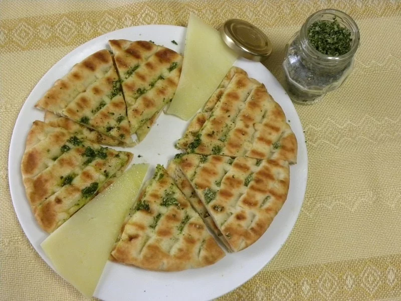 Greek pita chips with olive oil and oregano salt image