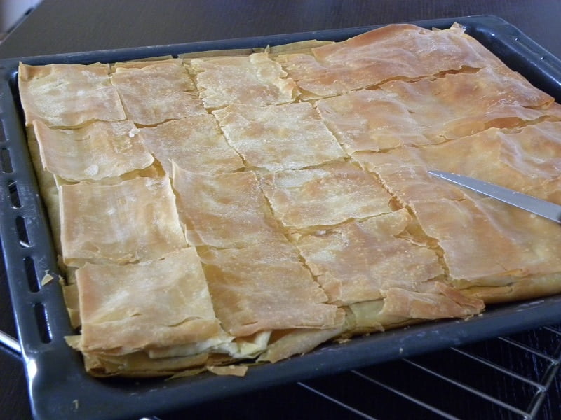 Homemade phyllo Tyropita in a large tray image