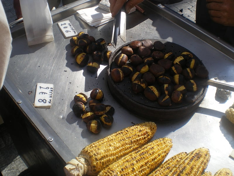 roasted chestnuts by street vendor image