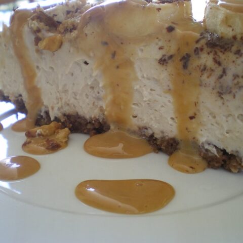A slice of Banoffee cheesecake with sauce image