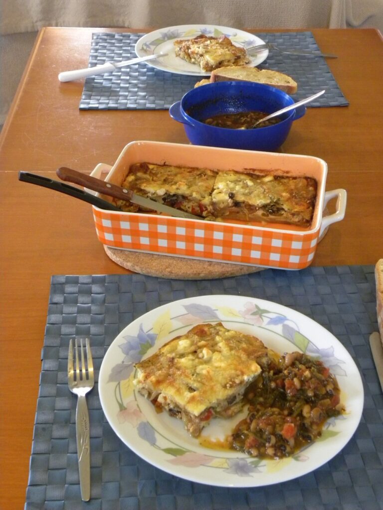 Vegetable millefeuilles served with salad as a main dish image