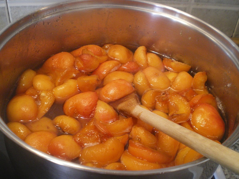 Cooking apricots to make jam image