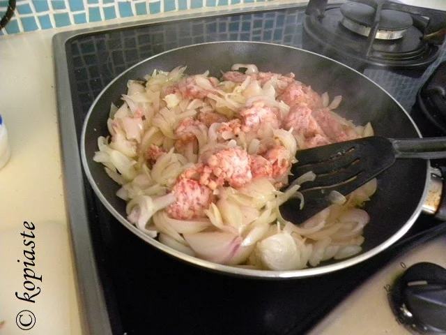 sauteing onions with sausage