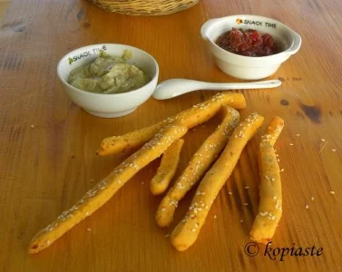spicy cornmeal bread sticks with graviera cheese and tomato chutney