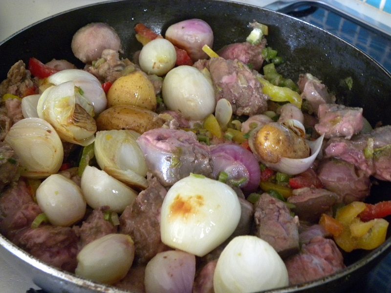 Sykoti riganato with onions and potatoes from our garden image