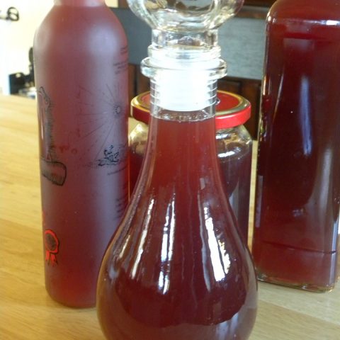 Pomegranate liqueur in bottles image