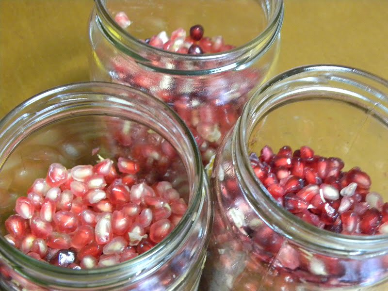 Pomegranate seeds in three jars photo