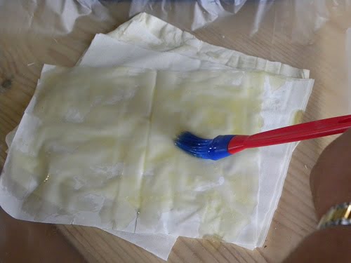 Brushing phyllo with butter image