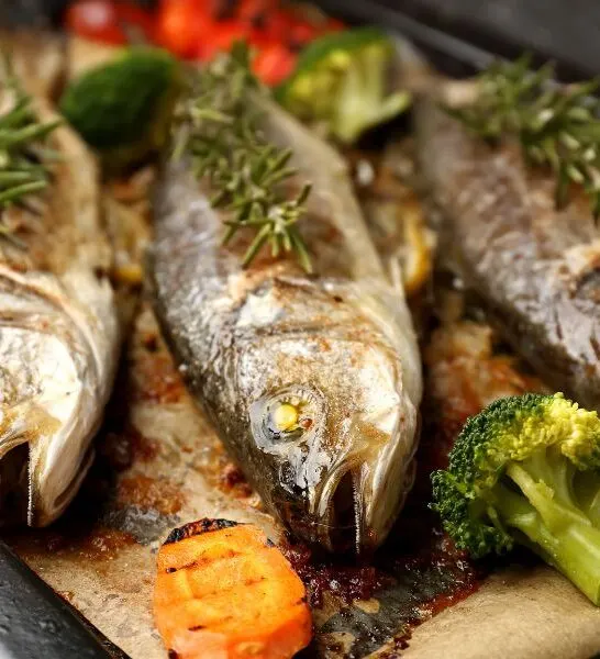 Lavraki Plaki (baked Branzino) on a Bed of Vegetables
