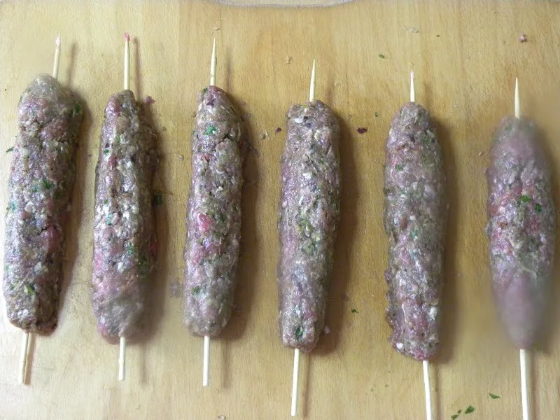 Shaping the kebabs around skewers image