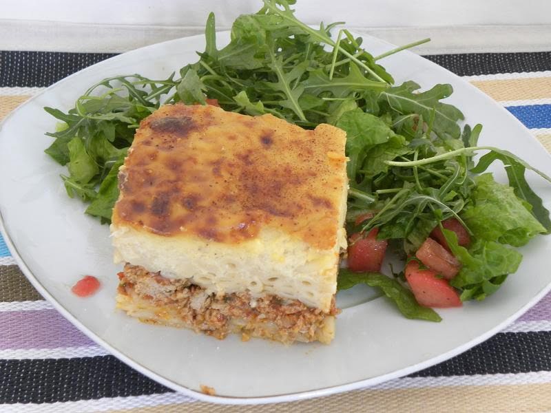 A slice of Pastitsio with salad photo