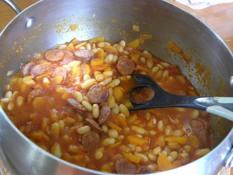cooking fassolada stewed beans image