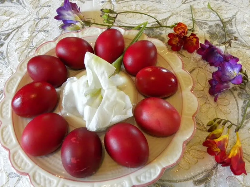 Dyed Easter red eggs with flowers image