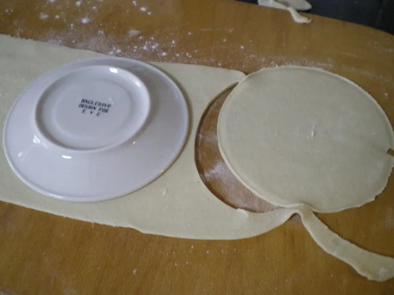 cutting dough with a plate image