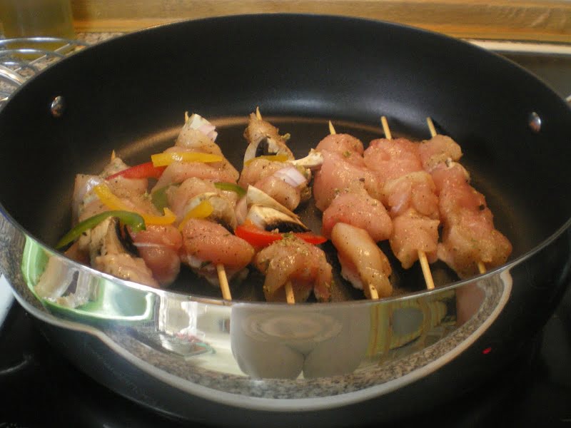 Grilling chicken souvlaki in the sautéing pan image