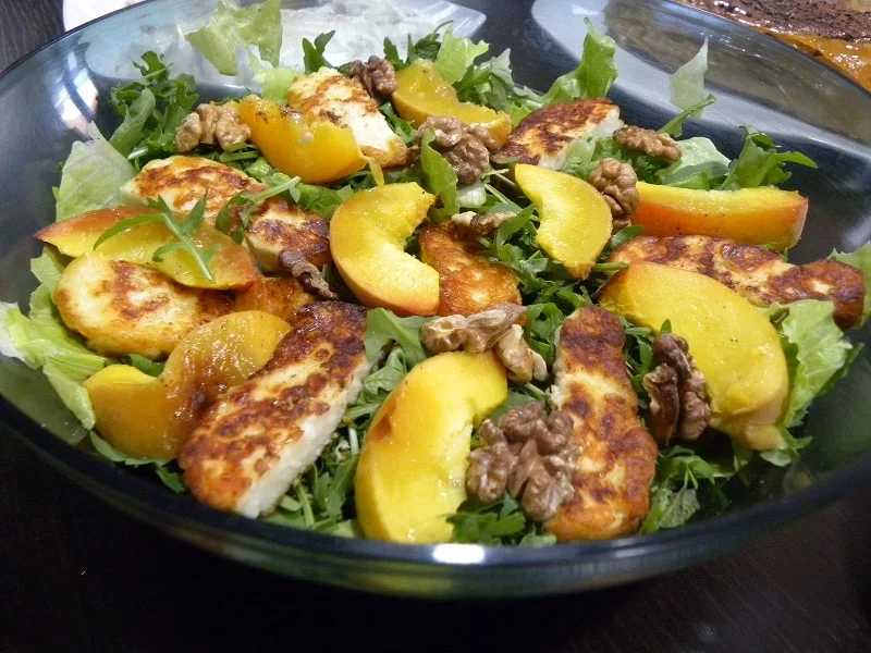 Rocket baked peached and halloumi salad image