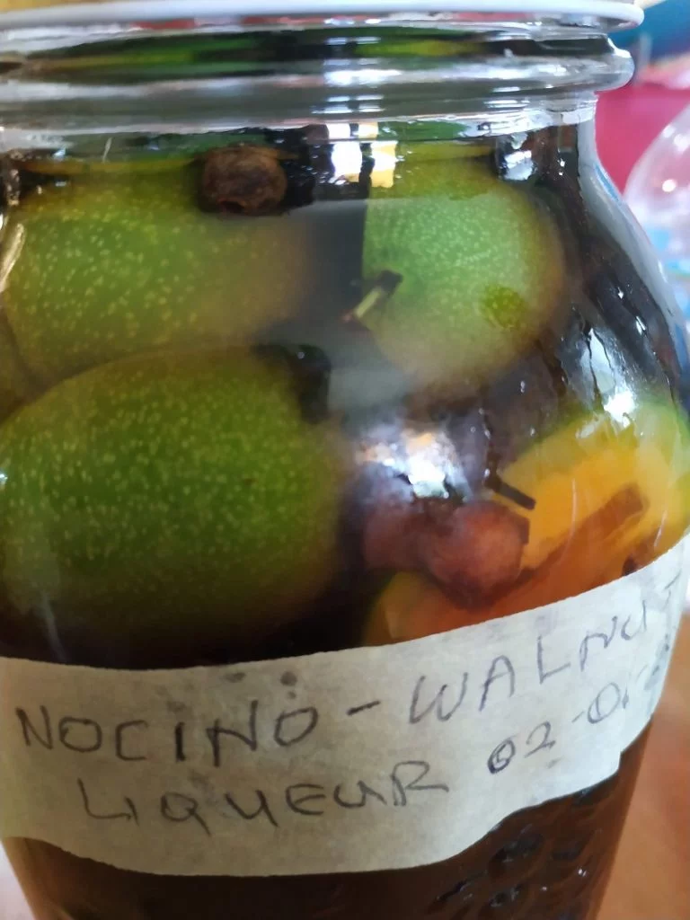 Steeping green walnuts in alcohol image