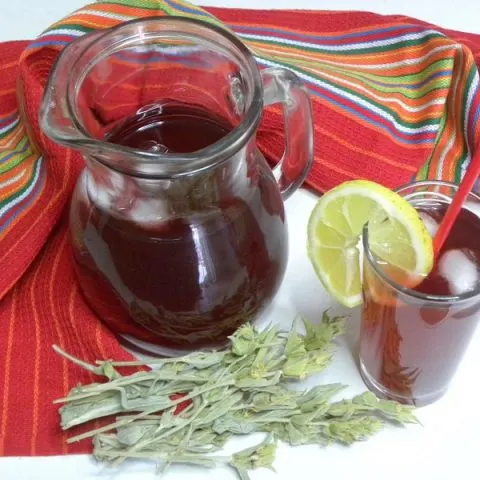 A jar and glass with tsai tou vounou image