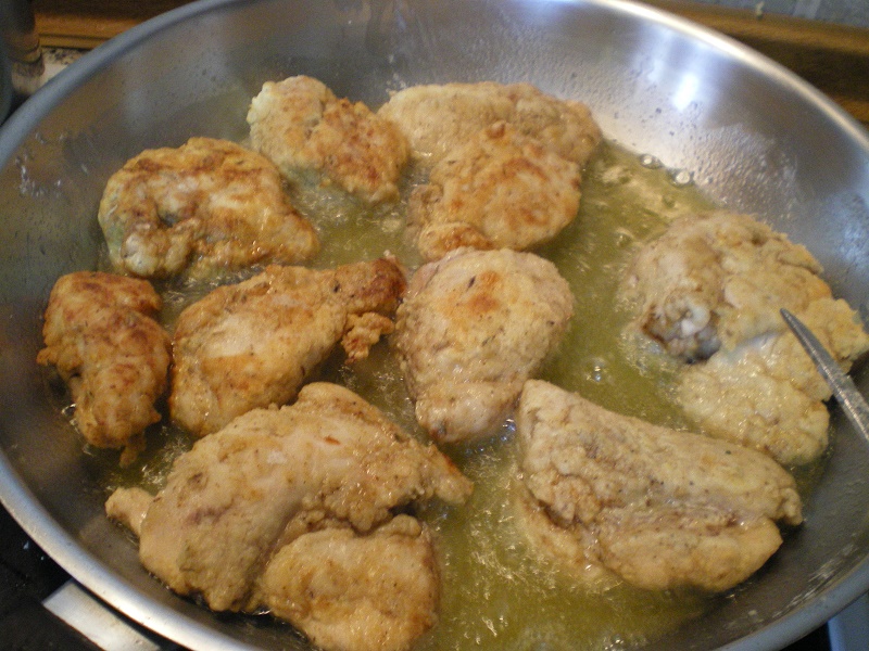 Sauteing chicken breast on both sides image