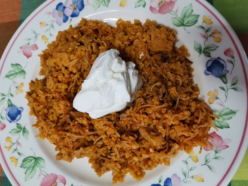 Bulgur wheat pilaf with leftover meat and gBulgur wheat pilaf with lefover meat and greek yoghurt imageoghurt image