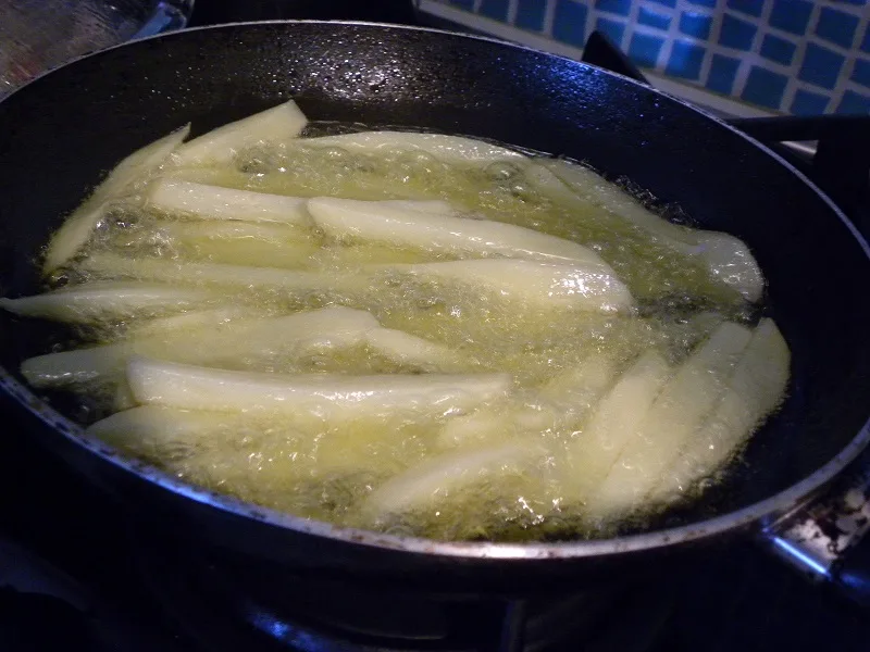 frying the potatoes image