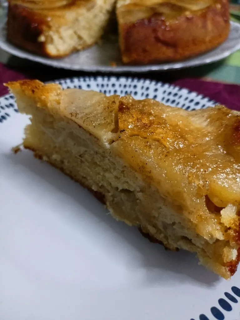 A slice of Greek upside down olive oil apple cake image