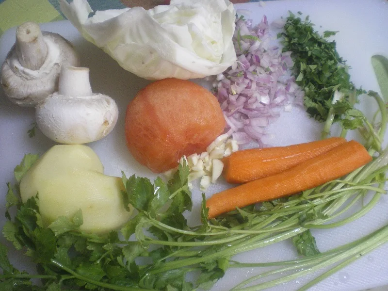 Ingredients to make chicken trahanas with vegetables image