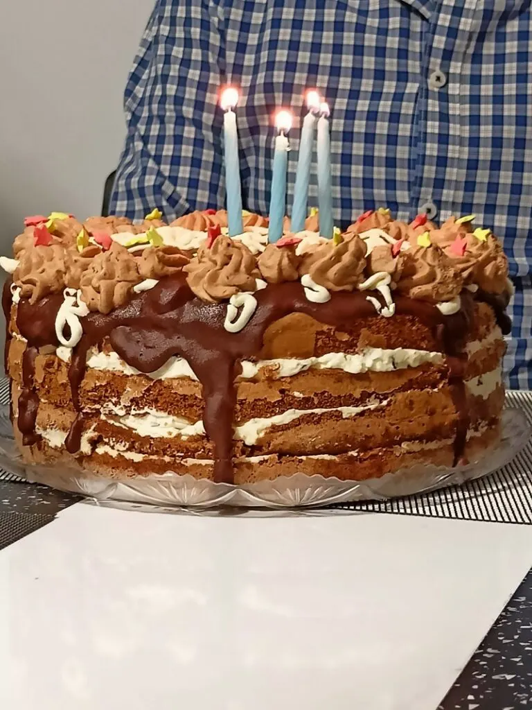Stracciatella, chocolate mocha cake with lit candles image