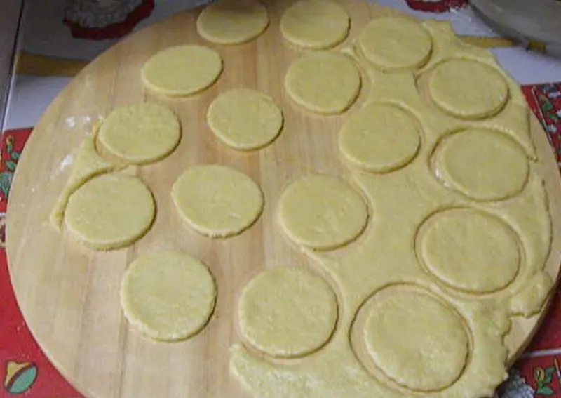 Cutting dough with a cookie cutter image