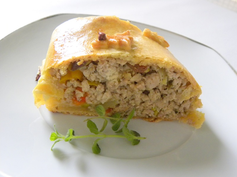 Piece of turkey pie roulade cut image