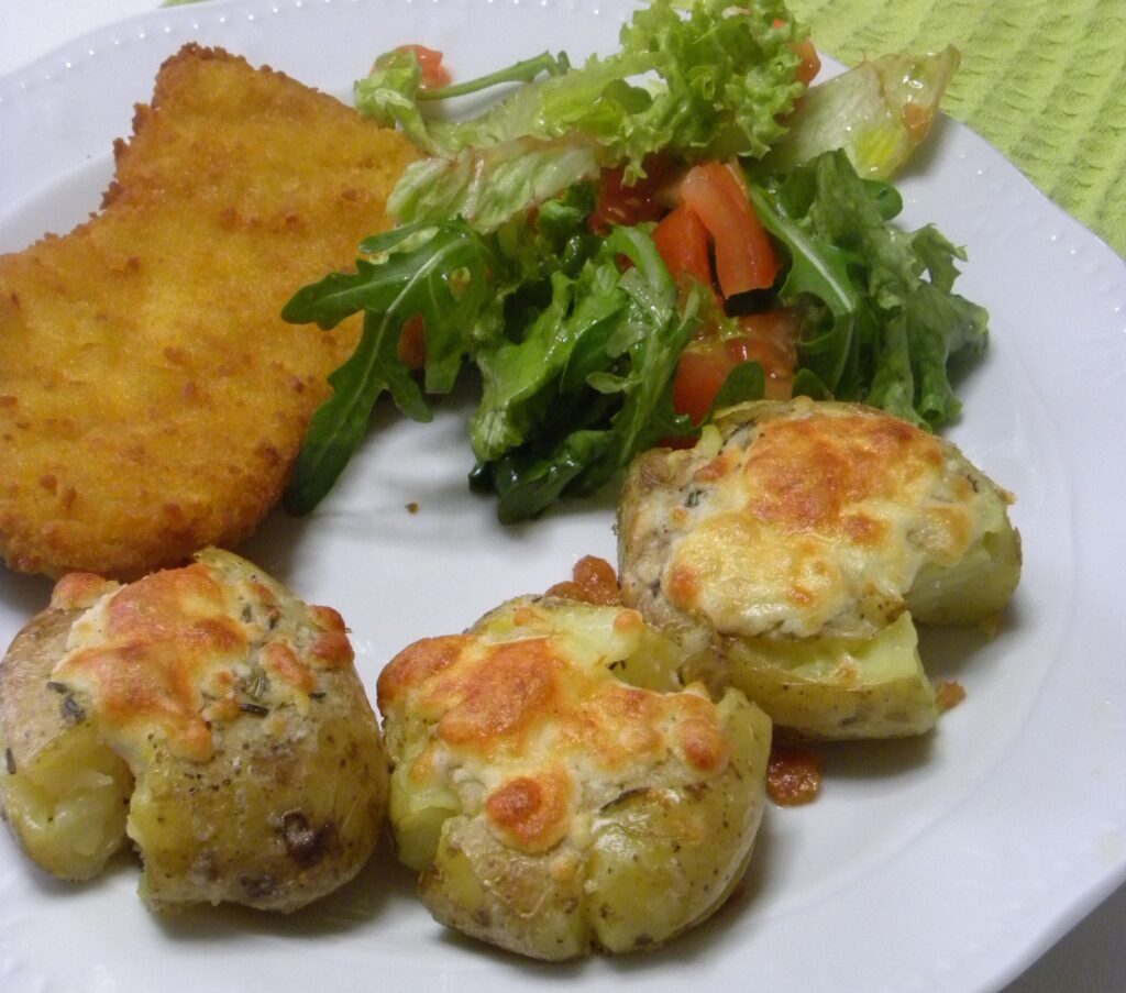 Smashed potatoes with schnitzel image