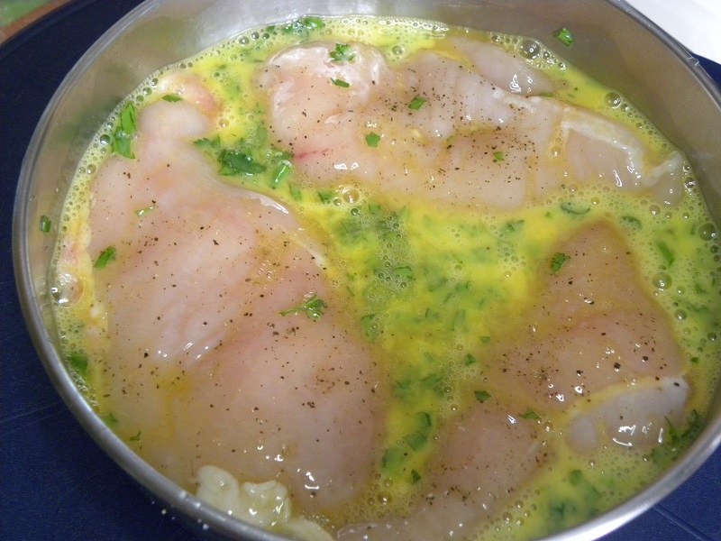 Marinating the chicken cutlets image.