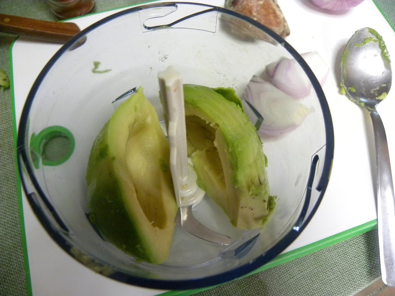 Putting the peeled avocado in the food processor image