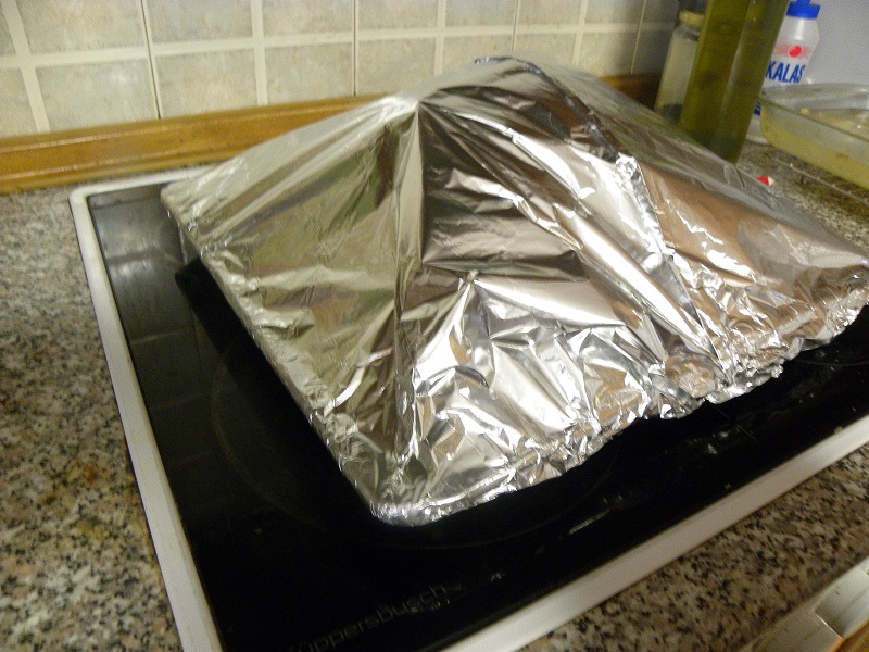 Baking tray wrapped in aluminium foil image