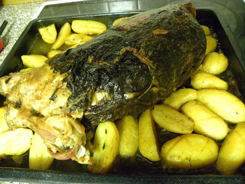 goat or lamb wrapped with vine leaves image