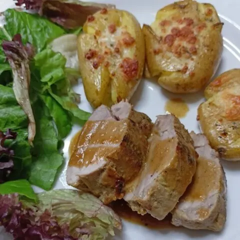 Marinated pork tenderloin with smashed potatoes and salad image