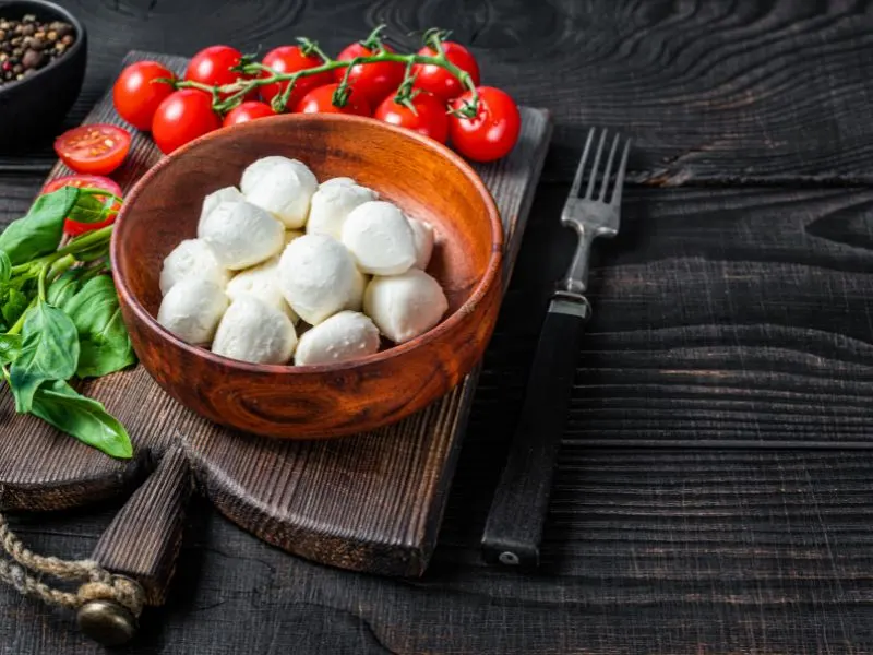Cherry tomatoes, mini mozzarella balls and basils image