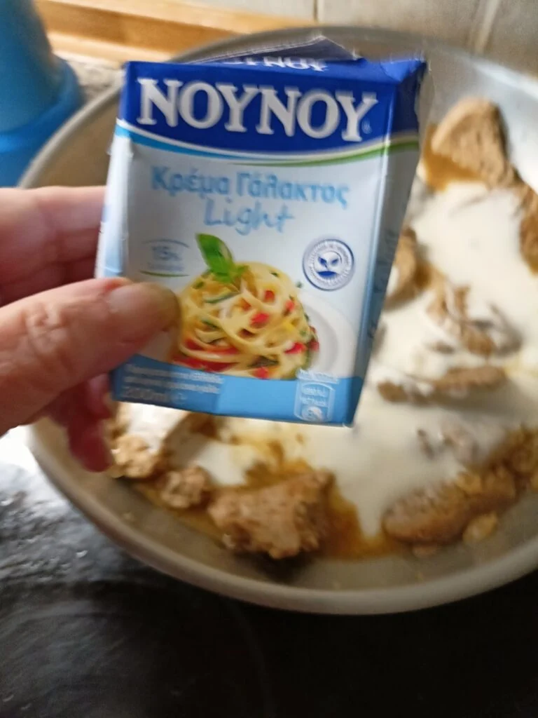 Adding the cream to the pork image