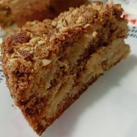 Piece of olive oil apple cake with almonds image