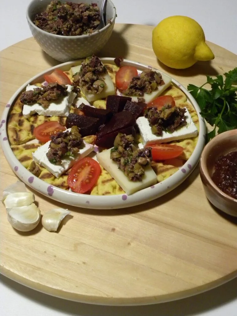 Epityron served along pickled beets and kydonopasto image