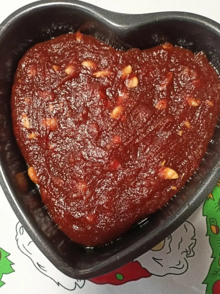 Kydonopasto, quince paste in a heart shaped tin image