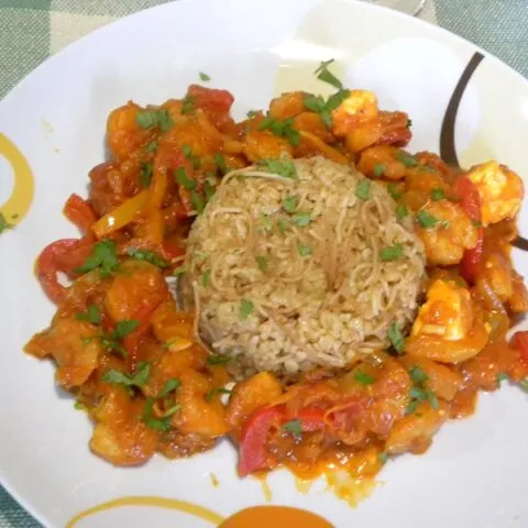 Prawn saganaki served with bulgur pilaf image