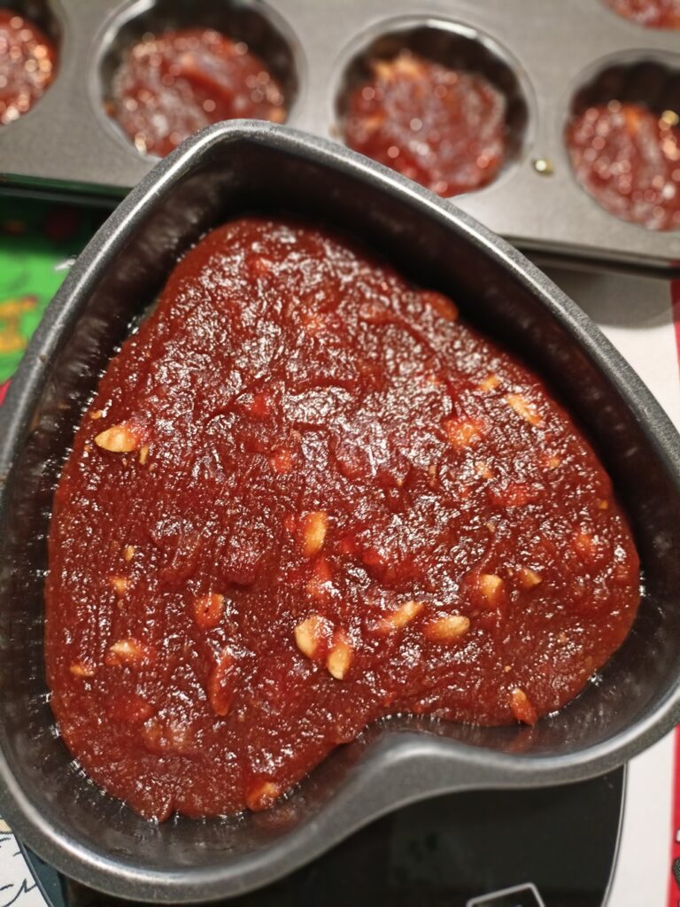 Quince paste, kydonopasto, in a muffin tin and a heart shaped tin image