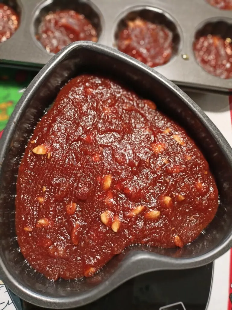 Quince paste, kydonopasto, in a muffin tin and a heart shaped tin image